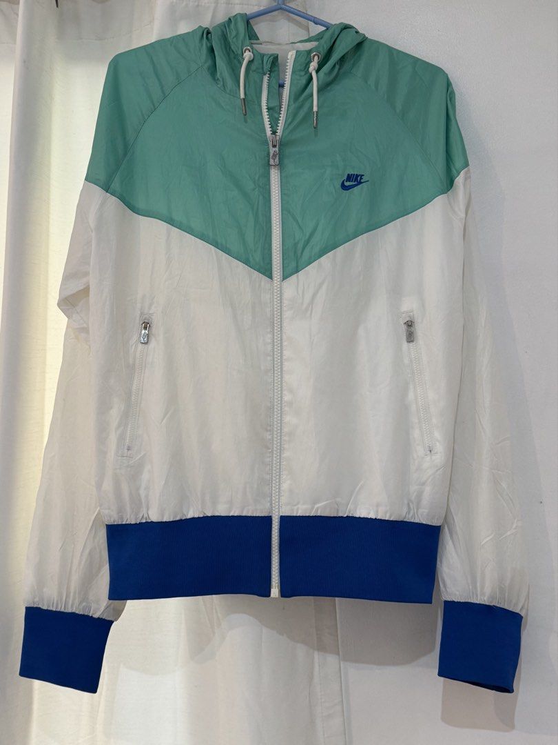 Nike Windrunner Jacket (Category: Coats, Jackets and Outerwear) located in Mandaue City. Submitted by meh.soh (Listing ID 1467299644, Image 3). Description: Size: S-M (for women) S (for men) White, Teal, and Blue colorblock Nike Windrunner jacket with a full zip and hood Mode of Payment: Gcash Delivery: Maxim (within Cebu) j&t (outside Cebu) (df shouldered by buyer) Location: Cubacub, Mandaue Cebu.