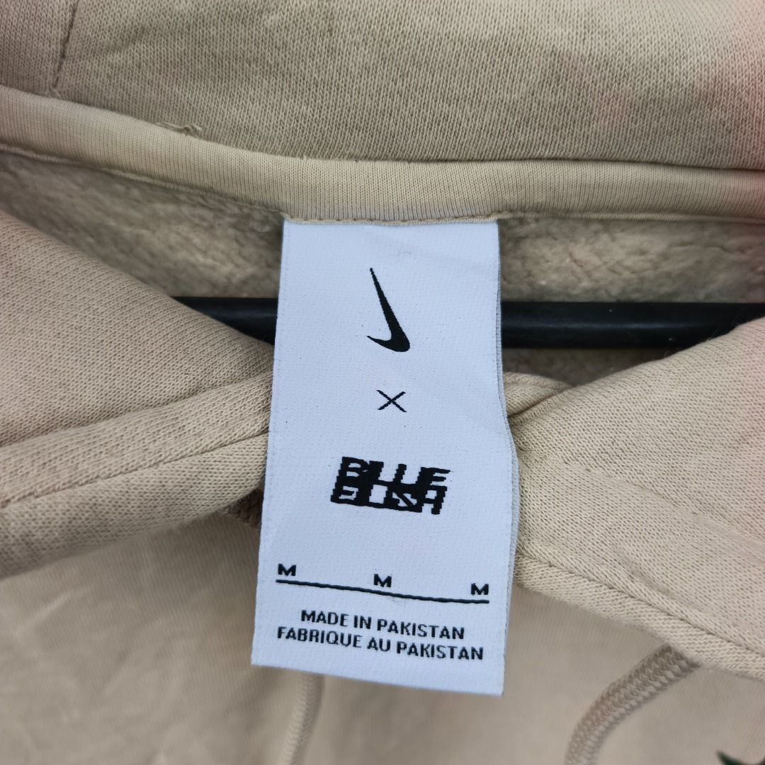 Nike x Billie Eilish Hoodie jacket (Category: Hoodies) located in Caloocan City. Submitted by evancaindo28330 (Listing ID 1467311708, Image 2). Description: - Brand: Nike - Color: Beige with embroidered green swoosh - Size: Medium (Standard Fit) - Material: Soft fleece interior, made in Pakistan - Features: Adjustable hood drawstrings and front kangaroo pocket - Condition: Clean overall look, great for casual styling.