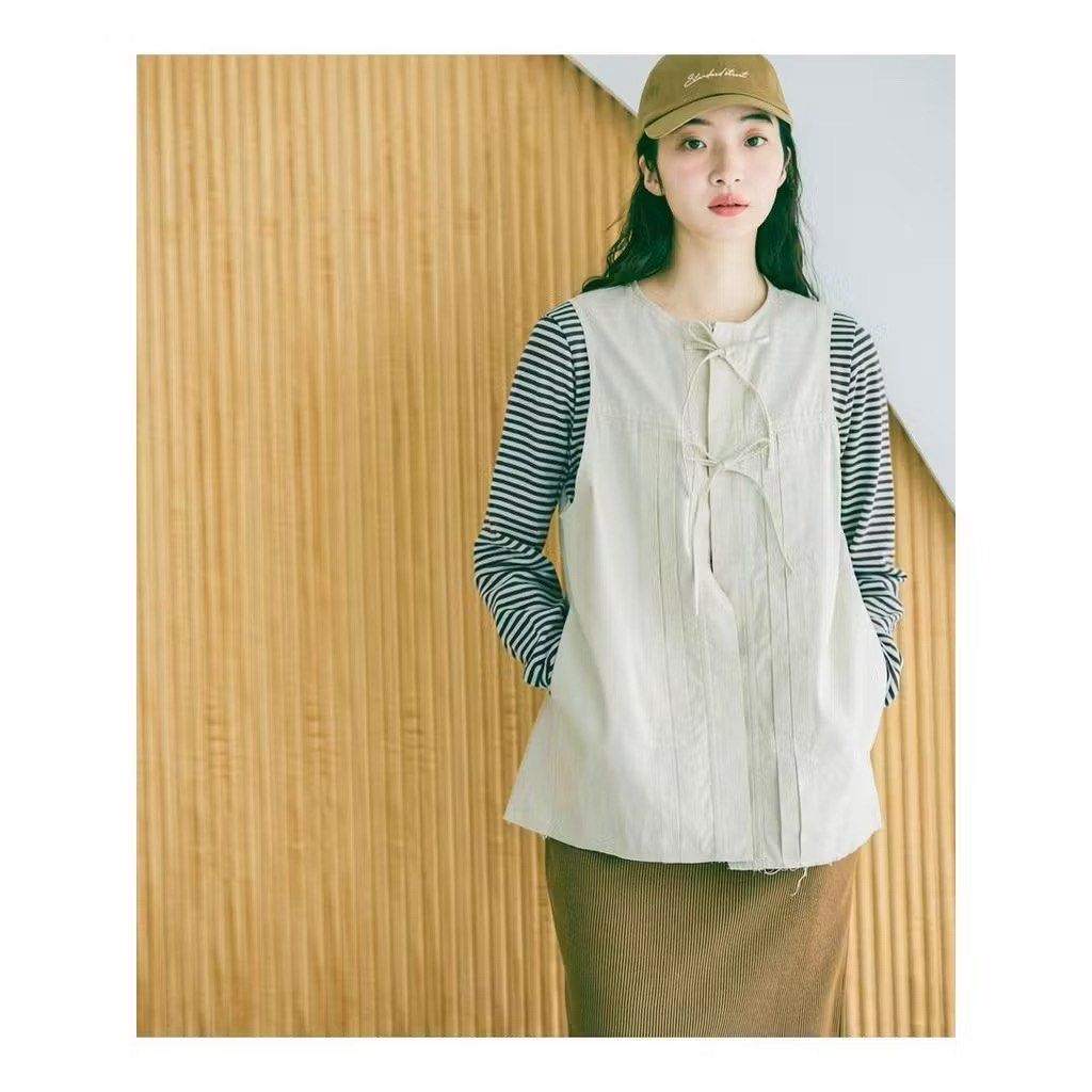 RUSH SALE! Niko and Off-white Tie Vest Top (Category: Sleeveless) located in Baguio. Submitted by lovelemons (Listing ID 1467178268, Image 1). Description: Niko and... Off-white Tie Vest Top Medium No issues Good as new condition .