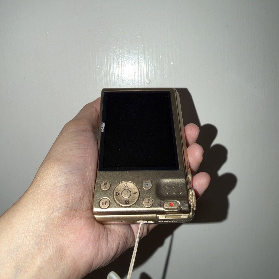 Nikon Coolpix S7000 Digital Camera Gold (Category: Cameras) located in Batangas. Submitted by amiwam4c (Listing ID 1467280193, Image 2). Description: 11,500 fixed - From Japan -Small and compact -Clean body and minimal signs of wear -Built-in Wi-Fi for easy photo sharing and Full HD video recording, 20x optical zoom. -Controls: LCD screen, navigation buttons, mode dial, and a dedicated video recording button. -Inclusions: Comes with a battery and