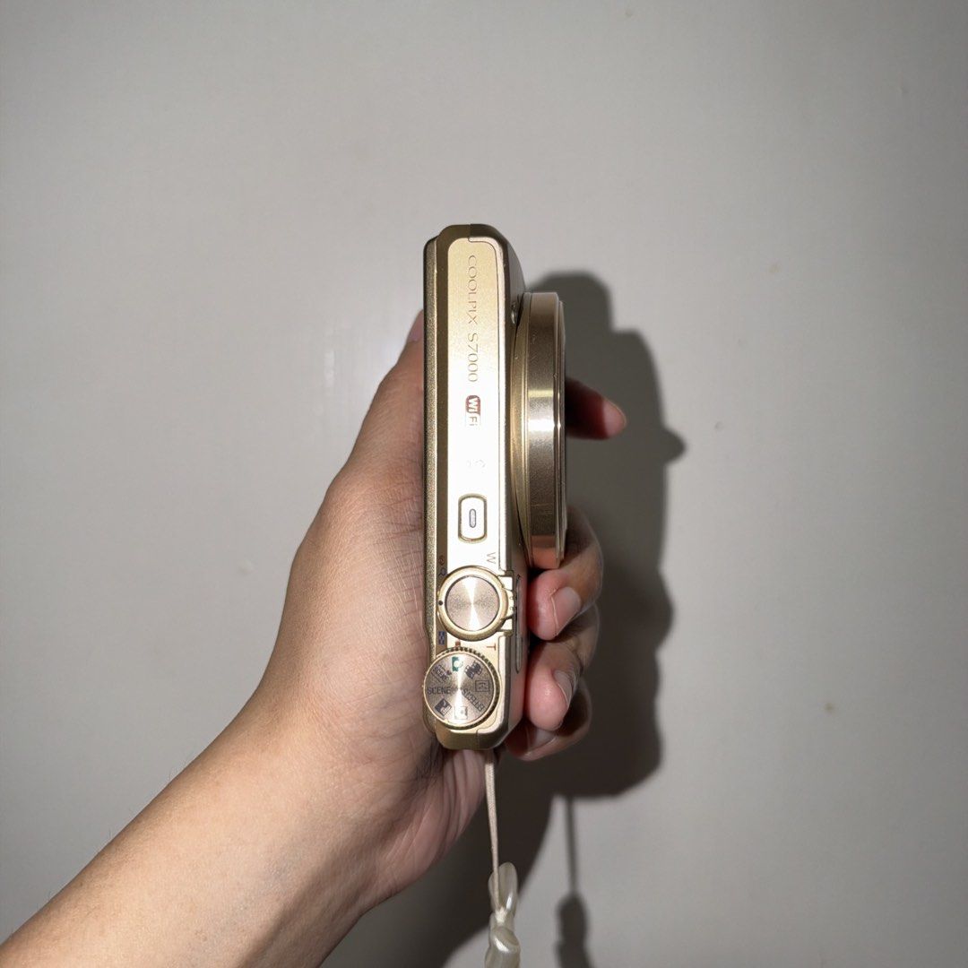Nikon Coolpix S7000 Digital Camera Gold (Category: Cameras) located in Batangas. Submitted by amiwam4c (Listing ID 1467280193, Image 3). Description: 11,500 fixed - From Japan -Small and compact -Clean body and minimal signs of wear -Built-in Wi-Fi for easy photo sharing and Full HD video recording, 20x optical zoom. -Controls: LCD screen, navigation buttons, mode dial, and a dedicated video recording button. -Inclusions: Comes with a battery and