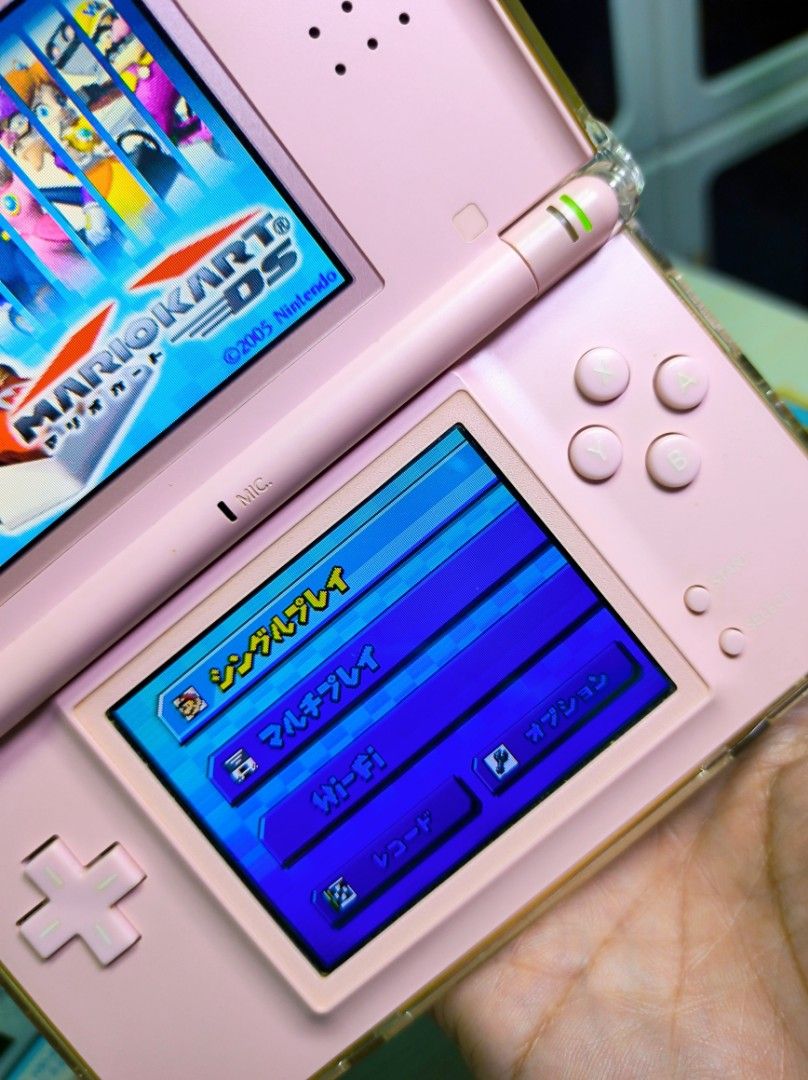 Nintendo DS Lite Pink Bundle with Games and AC Adapter (Category: Nintendo) located in Caloocan City. Submitted by greenearth28555 (Listing ID 1467240810, Image 2). Description: ‼️ PLEASE READ‼️ - Pink Nintendo DS Lite - 100% no issue 👌✨ - Condition: Fully tested, powers on, and screens work normally - with original stylus - Game in Console: Mario Kart DS, Dragon Ball DS, and New Super Mario Bros. - Accessories: Original AC adapter included in b