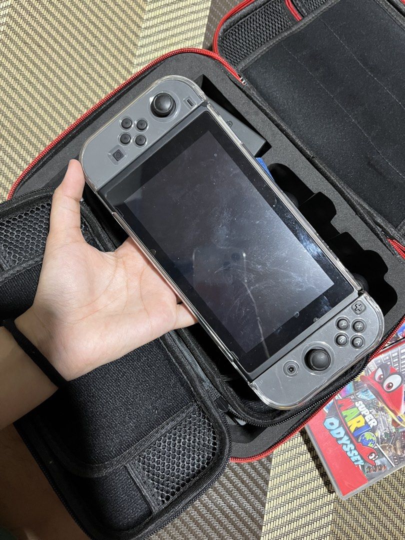 NINTENDO Switch | read description (Category: Nintendo) located in Manila. Submitted by kathryn.frs (Listing ID 1467337456, Image 2). Description: READ FIRST ‼️ open to negotiate - complete inclusion - with casing and themed box - fully working - no cartridges - with HDMI cord for connection - bought directly from toys kingdom w warranty card - bought 2019 - only used twice, kept in the box ever since .