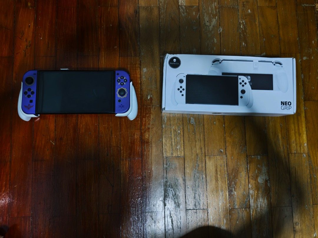 Nintendo Switch OLED (Category: Nintendo) located in Singapore. Submitted by IgnTYT (Listing ID 1467320577, Image 1). Description: Seeling the Nintendo Switch OLED Model Together with all the accessories included such as HDMI, AC ADAPTER, JOYCON GRIP, JOYCON STRAP, DOCK + A GRIP FROM NEOGRIP.