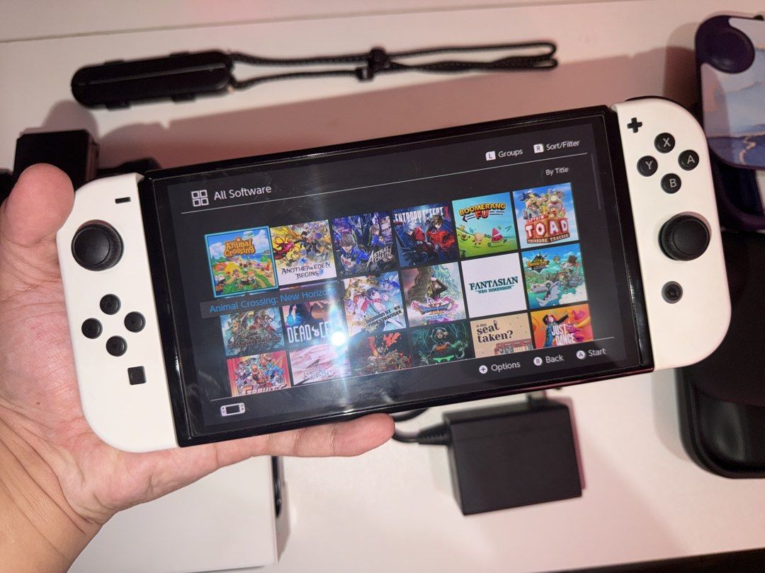 Nintendo Switch OLED JB Model 256gb with Hall Effect Joycons (Category: Nintendo) located in Valenzuela. Submitted by gamechilo (Listing ID 1467282614, Image 1). Description: - Item: Nintendo Switch OLED JAILBREAK (White) 256gb - JB by premazing ph - Hall Effect Joycons - kaya never na magkaka stick drift - Very smooth pa 90% - Included Accessories: Original dock, Power adapter, wrist strap, 2 cases + replacement HDMI cable - with 2 extra tempere