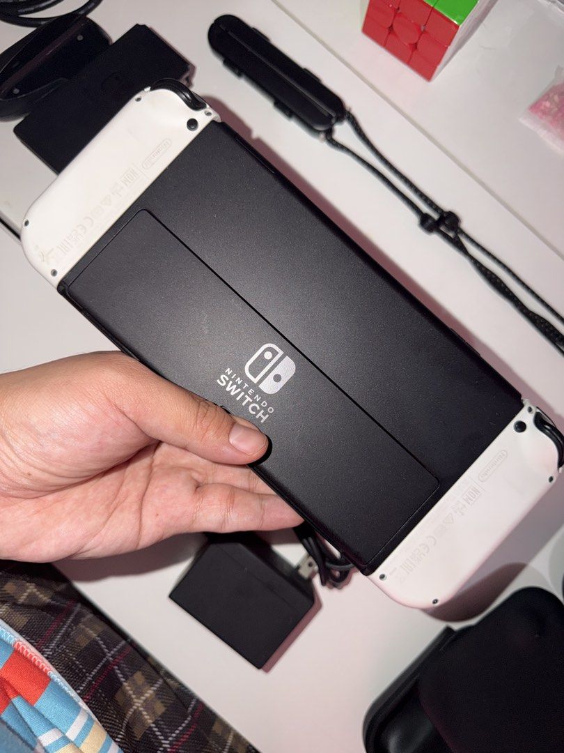 Nintendo Switch OLED JB Model 256gb with Hall Effect Joycons (Category: Nintendo) located in Valenzuela. Submitted by gamechilo (Listing ID 1467282614, Image 2). Description: - Item: Nintendo Switch OLED JAILBREAK (White) 256gb - JB by premazing ph - Hall Effect Joycons - kaya never na magkaka stick drift - Very smooth pa 90% - Included Accessories: Original dock, Power adapter, wrist strap, 2 cases + replacement HDMI cable - with 2 extra tempere
