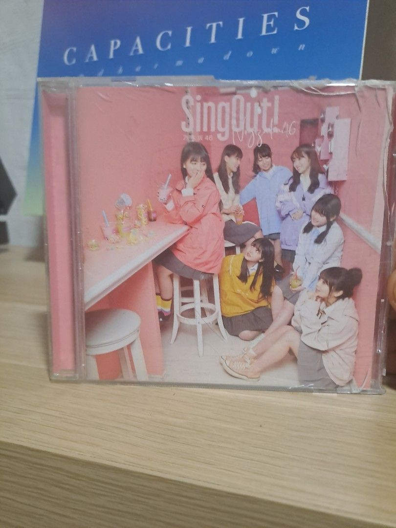 Nogizaka46 Sing Out! CD Album (Category: CDs & DVDs) located in Las Pinas. Submitted by cobieshop (Listing ID 1467321173, Image 1). Description: - Artist: Nogizaka46 - Album: Sing Out! (Standard Edition) - Format: Audio CD in jewel case - Inclusions: Cover insert featuring members in the pink room setup - Condition: Playable and well-maintained - Perfect for J-pop fans and collectors!.