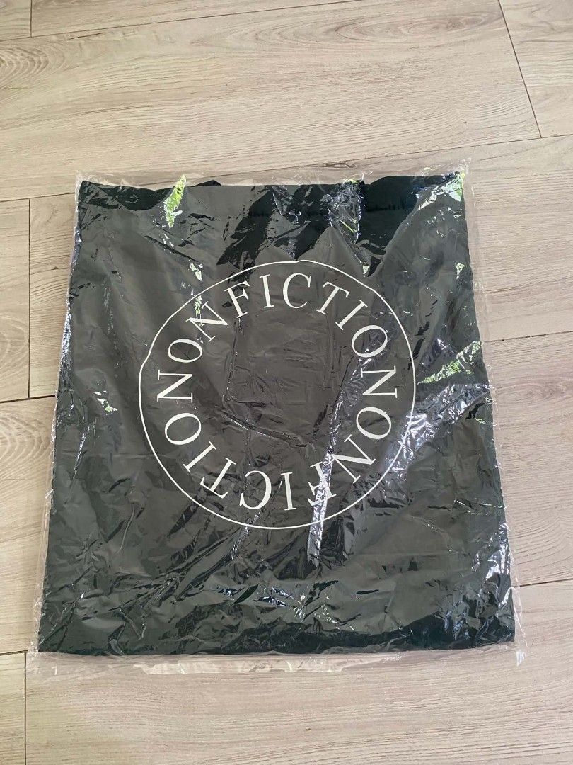 Nonfiction Black Tote Bag (Category: Tote Bags) located in Makati City. Submitted by larasdowry (Listing ID 1467323309, Image 1). Description: Brand new black canvas tote bag from Nonfiction featuring the iconic white circular logo. Still sealed in its original plastic packaging, straight from the store..