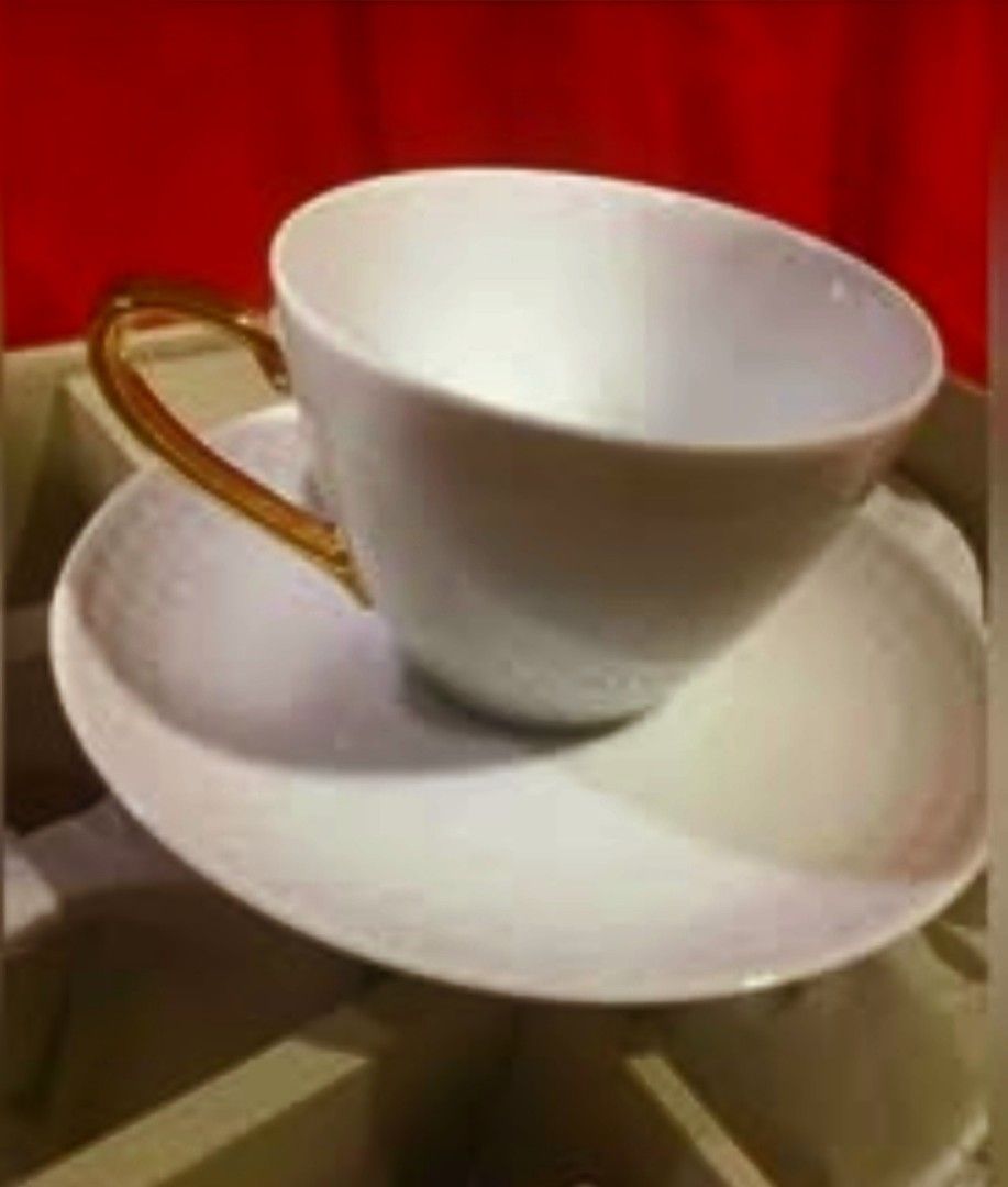 Noritake White Ceramic Cup and Saucer Set in Box (Category: Coffee & Tea Tableware) located in Cainta. Submitted by veronica2277 (Listing ID 1467266449, Image 3). Description: - Brand: Noritake - Item: White ceramic cup and saucer set - Design: Subtle textured exterior with a glossy finish and gold-toned handles - Condition: Brand new, never used - Packaging: Complete set in original branded presentation box with protective paper Note: saucers ha