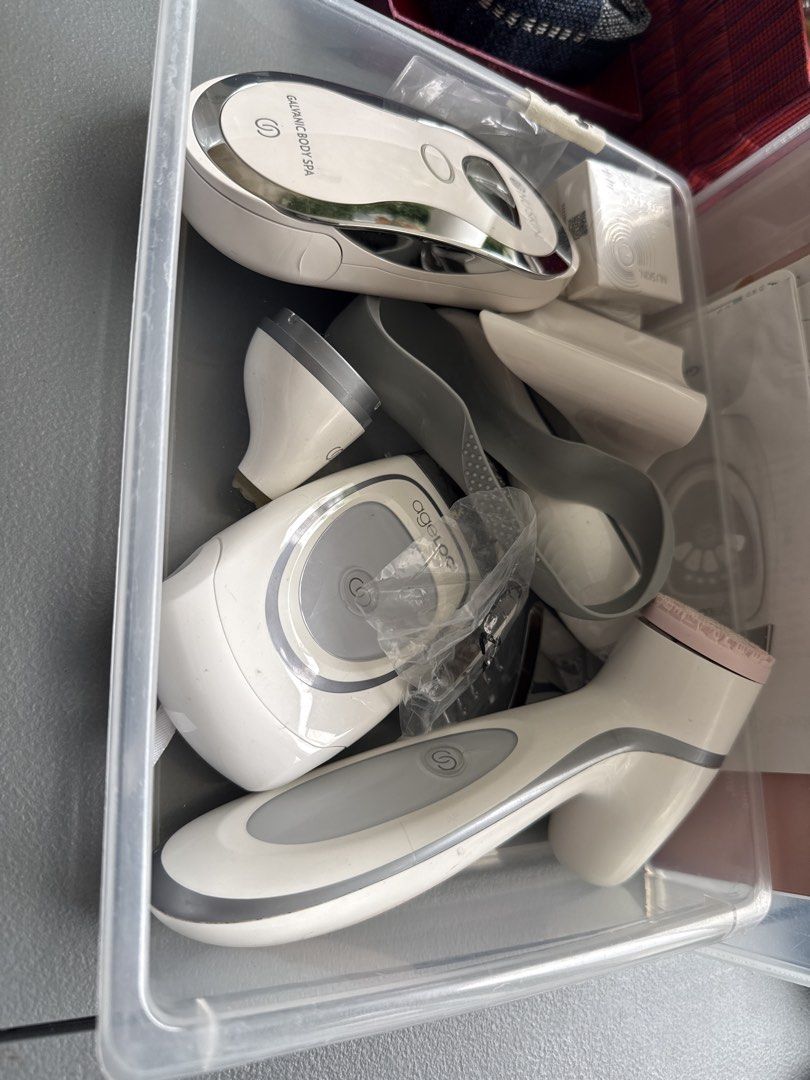 Nu Skin ageLOC Galvanic Spa Body Spa Device Bundle (Category: Body Care) located in Paranaque City. Submitted by shopatnicx (Listing ID 1467233971, Image 1). Description: - 499 each - Nu Skin items: ageLOC Galvanic Body Spa and facial spa system - Includes multiple interchangeable heads, charging stand, gray storage pouch, and replacement box - Neatly organized inside a plastic storage bin - Condition: Used with minor surface scuffs from regular 