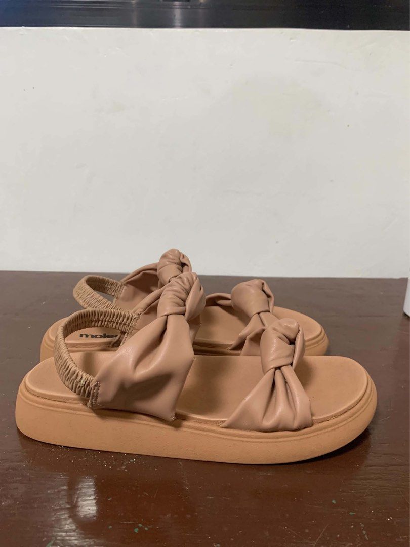 Nude platform sandals size 10 wide (Category: Flats & Sandals) located in Borongan. Submitted by kabes_jane (Listing ID 1467188300, Image 1). Description: - Color: Versatile nude shade - Design: Double straps with knotted details and thick sole - Fit: Elastic back strap for easy slip-on wear and secure fit - Perfect for everyday casual outfits - Size 10 wide.