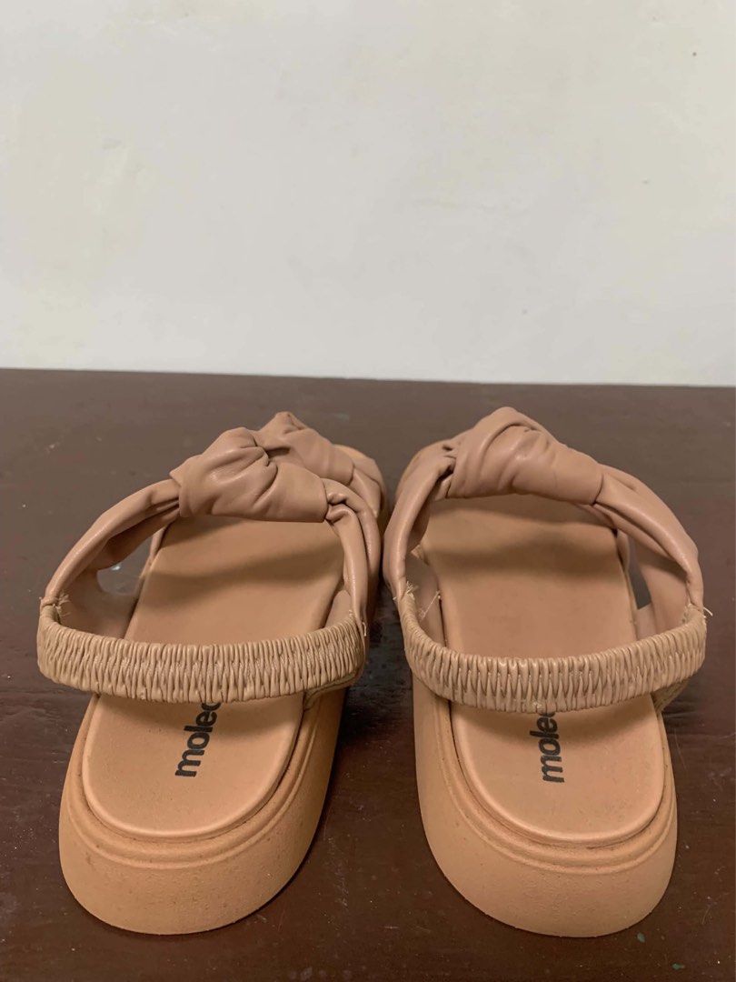 Nude platform sandals size 10 wide (Category: Flats & Sandals) located in Borongan. Submitted by kabes_jane (Listing ID 1467188300, Image 3). Description: - Color: Versatile nude shade - Design: Double straps with knotted details and thick sole - Fit: Elastic back strap for easy slip-on wear and secure fit - Perfect for everyday casual outfits - Size 10 wide.