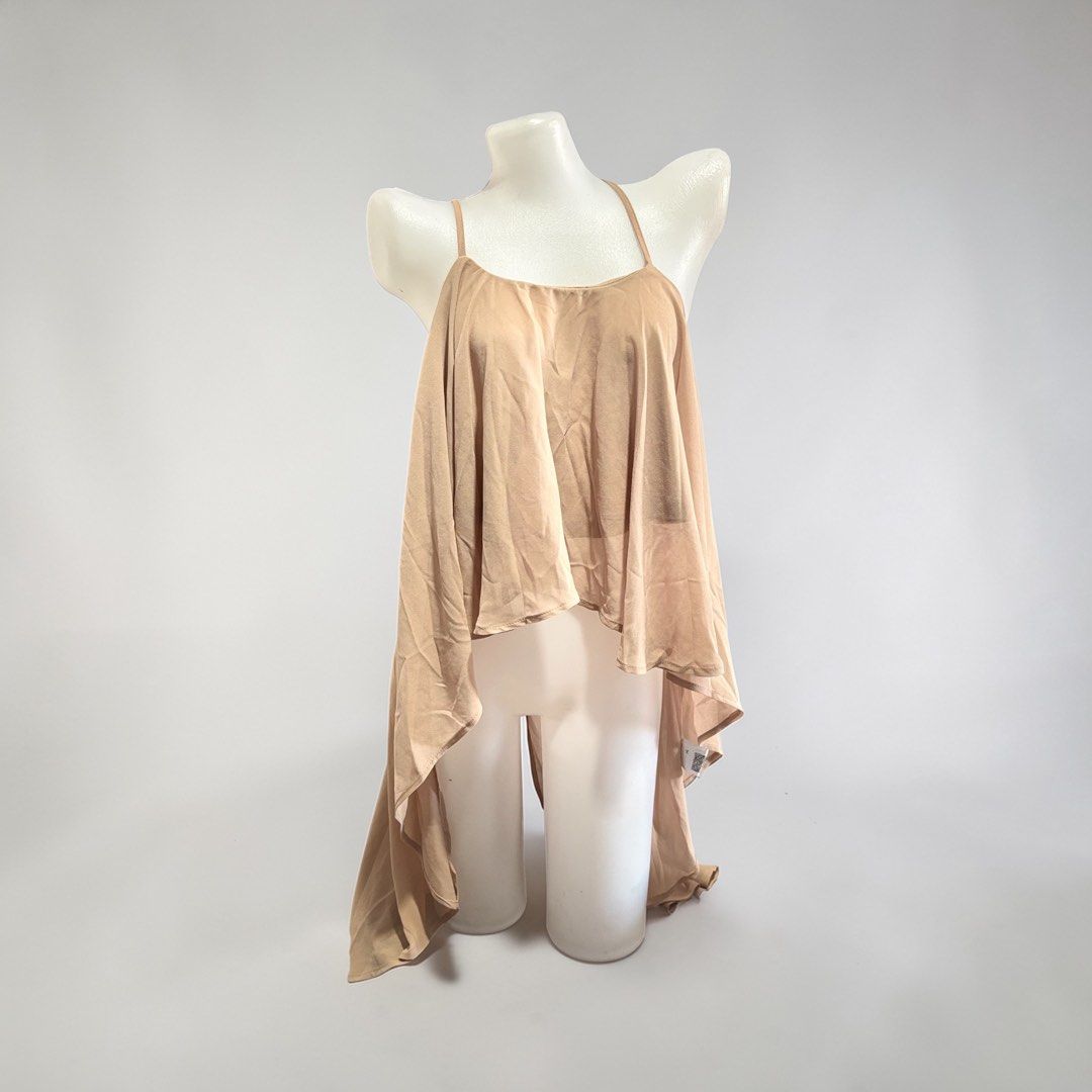Nude Spaghetti Strap High-Low Flowy Camisole Top (Category: Sleeveless) located in Santa Cruz. Submitted by homedecluttersale (Listing ID 1467355567, Image 1). Description: • Bought in Shein • Brand new / unused • Fits medium to large • In excellent condition • Photos taken using mannequin only 🚚 Shipping via J&T only 📦 Shipping fee to be shouldered by buyer 💳 Mode of payment: GCash 📍 Santa Cruz, Laguna.