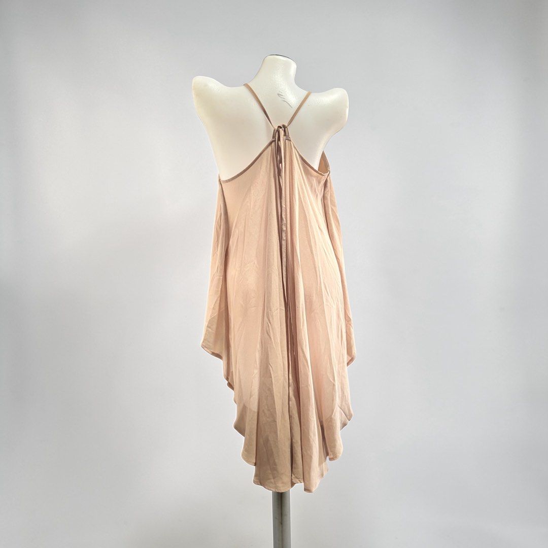 Nude Spaghetti Strap High-Low Flowy Camisole Top (Category: Sleeveless) located in Santa Cruz. Submitted by homedecluttersale (Listing ID 1467355567, Image 2). Description: • Bought in Shein • Brand new / unused • Fits medium to large • In excellent condition • Photos taken using mannequin only 🚚 Shipping via J&T only 📦 Shipping fee to be shouldered by buyer 💳 Mode of payment: GCash 📍 Santa Cruz, Laguna.