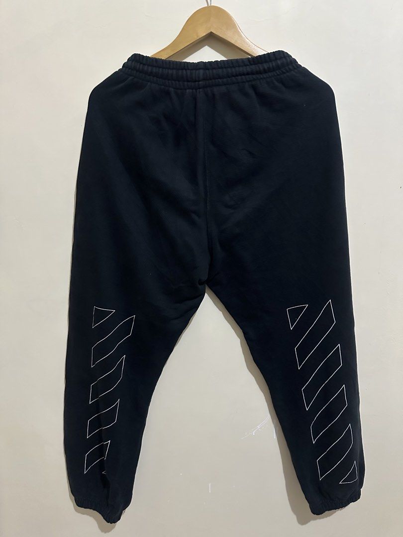Off-White Black Sweatpants (Category: Joggers) located in Tagum. Submitted by ritarits572 (Listing ID 1467289100, Image 2). Description: - Brand: Off-White - Color: Black - Size: S, 13 x 37 - Material: 100% cotton main fabric with polyester embroidery - Features: Drawstring waist, side pockets, and interior tags attached - Design: Small white logo print near the front pocket and iconic diagonal stripe graphics down the back of both legs.