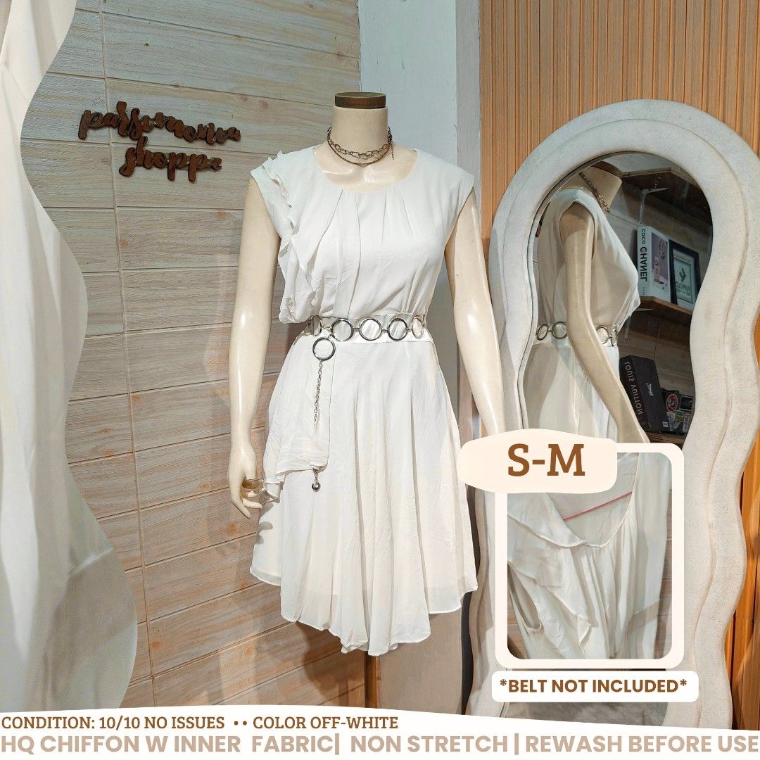 Off-White Chiffon Ruffle Dress S-M (Category: Dresses) located in Bulacan. Submitted by alyssarys (Listing ID 1467356828, Image 1). Description: - Color: Off-white - Material: High-quality chiffon with full inner lining (non-stretch) - Size: Fits Small to Medium - Design: Ruffle details on shoulders and front, chic asymmetric hemline - Best for: Dates, brunch, or casual outings - Important: Metal belt in photos is NOT included.