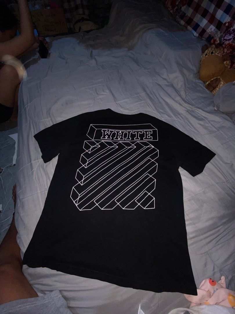 Off-White Hand Graphic Black T-Shirt (Category: Tshirts & Polo Shirts ) located in Cagayan de Oro. Submitted by zekoy (Listing ID 1467275774, Image 3). Description: Authentic Off-White black short-sleeve t-shirt in regular fit. Features hand graphic print on the front and iconic 3D diagonal stripes on the back. Made of comfortable cotton with standard interior neckline branding. Clean condition, ready to wear..