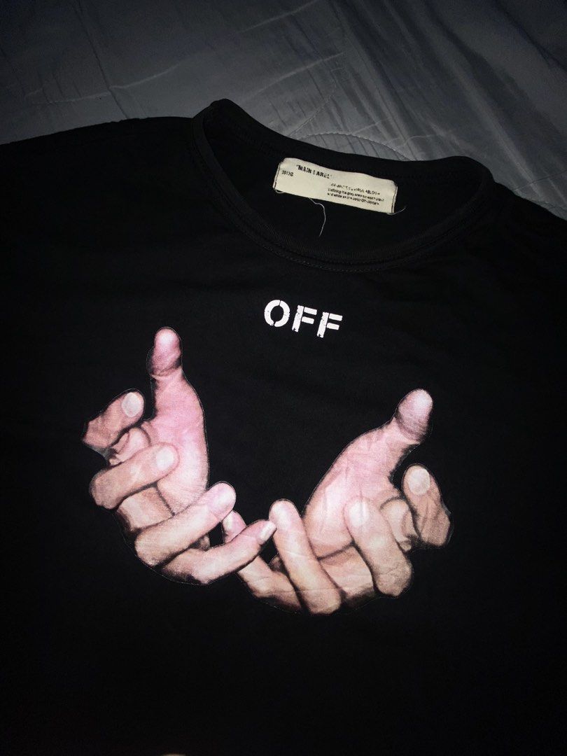 Off-White Hand Graphic Black T-Shirt (Category: Tshirts & Polo Shirts ) located in Cagayan de Oro. Submitted by zekoy (Listing ID 1467275774, Image 2). Description: Authentic Off-White black short-sleeve t-shirt in regular fit. Features hand graphic print on the front and iconic 3D diagonal stripes on the back. Made of comfortable cotton with standard interior neckline branding. Clean condition, ready to wear..