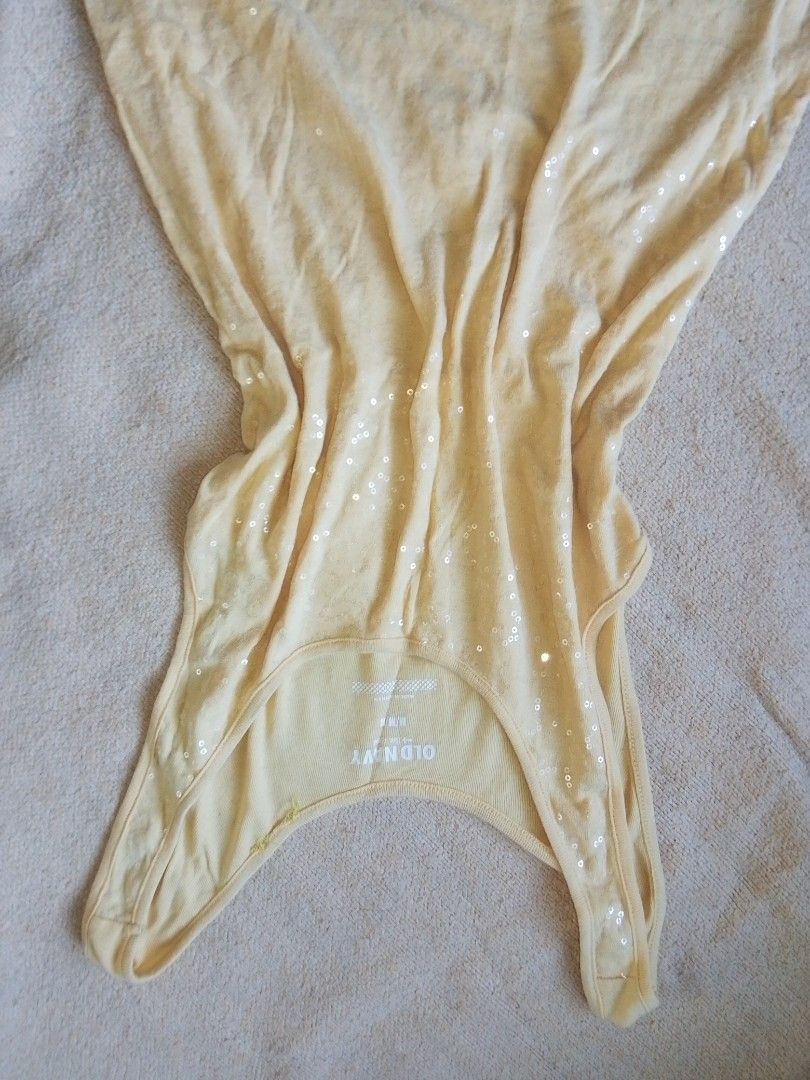 Old Navy Yellow Sequined Tank Top Size M (Category: Sleeveless) located in Narvacan. Submitted by yelri555 (Listing ID 1467330135, Image 1). Description: - Brand: Old Navy - Color: Bright Yellow - Size: Medium (based on inner tag) - Details: Cute sequin embellishments sprinkled across the fabric, scoop neckline with ribbed trim - Material: Lightweight and breathable - Style: Casual, easy to pair with jeans or shorts - Condition: Great pre-loved c