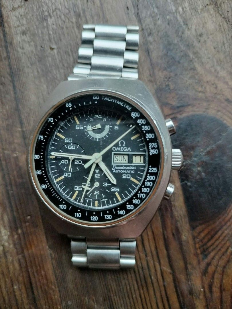 Omega Speedmaster Mark IV Automatic Chronograph Watch (Category: Luxury Watches) located in Manila. Submitted by wwwquijcom (Listing ID 1467276900, Image 2). Description: - Brand/Model: Omega Speedmaster Mark IV Chronograph - Dial: Black with day and date window at 3 o'clock - Complications: Multiple subdials (24-hour display, running seconds, elapsed minutes) and outer tachymeter scale - Case & Bracelet: Stainless steel tonneau-shaped case with 