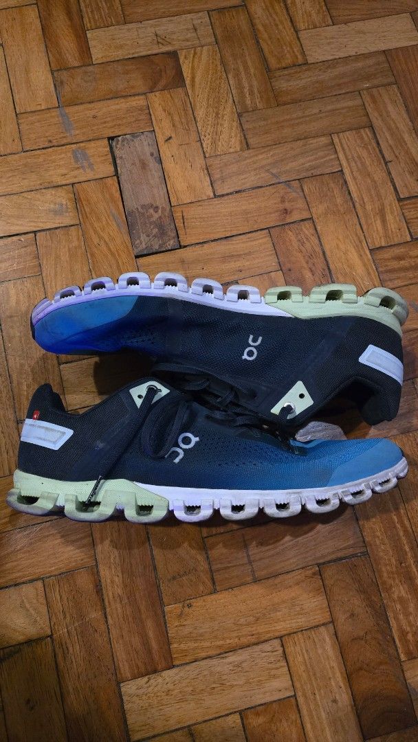 On Cloud Running Shoes Blue Black (Category: Sneakers) located in Pasig City. Submitted by johnflan (Listing ID 1467341920, Image 2). Description: On running shoes in a blue and black gradient colorway. Swiss engineering branding on the heel and tongue. Mesh upper construction with signature cloud cushioning pods on the sole. Lace-up closure with dark blue laces. Comfortable athletic footwear suitable for workouts or casual wear..