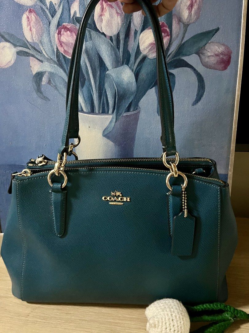 Original Coach Shoulder Bag (Category: Shoulder Bags) located in Quezon City. Submitted by madshoppe (Listing ID 1467256034, Image 2). Description: Original Like new but not perfect because this is preloved, pass sa maarte at maselan na gusto ng brand new sa presyong preloved No lowballers No flaws Teal or blue green in color Med size With sling .