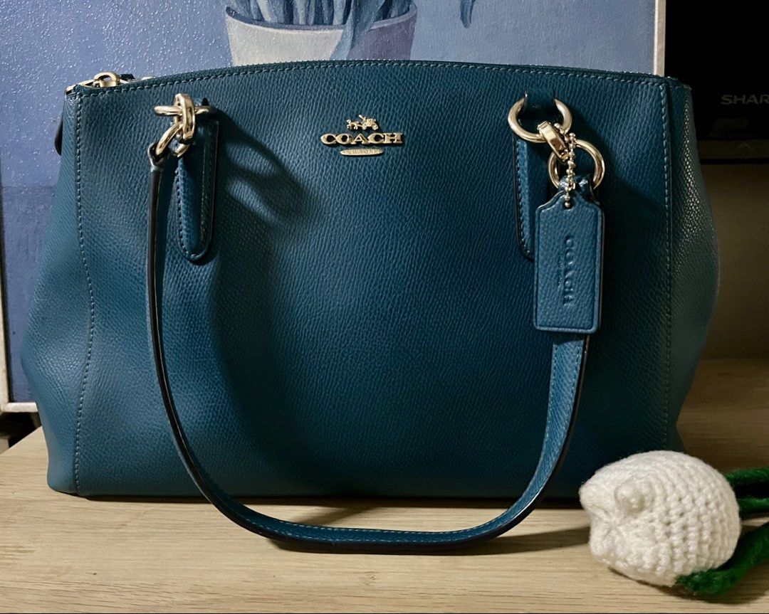Original Coach Shoulder Bag (Category: Shoulder Bags) located in Quezon City. Submitted by madshoppe (Listing ID 1467256034, Image 1). Description: Original Like new but not perfect because this is preloved, pass sa maarte at maselan na gusto ng brand new sa presyong preloved No lowballers No flaws Teal or blue green in color Med size With sling .