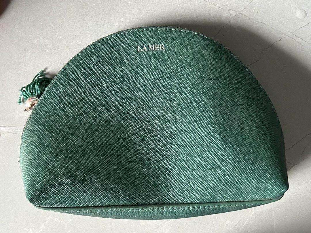 Original La Mer Green Makeup Pouch (Category: Purses & Pouches) located in Manila. Submitted by joisirel (Listing ID 1467241435, Image 1). Description: Original La Mer Pouch! Barely used, natambak lang po kaya nag accumulate ng dirt. But once cleaned, its all good. Negotiable for sure buyer!.