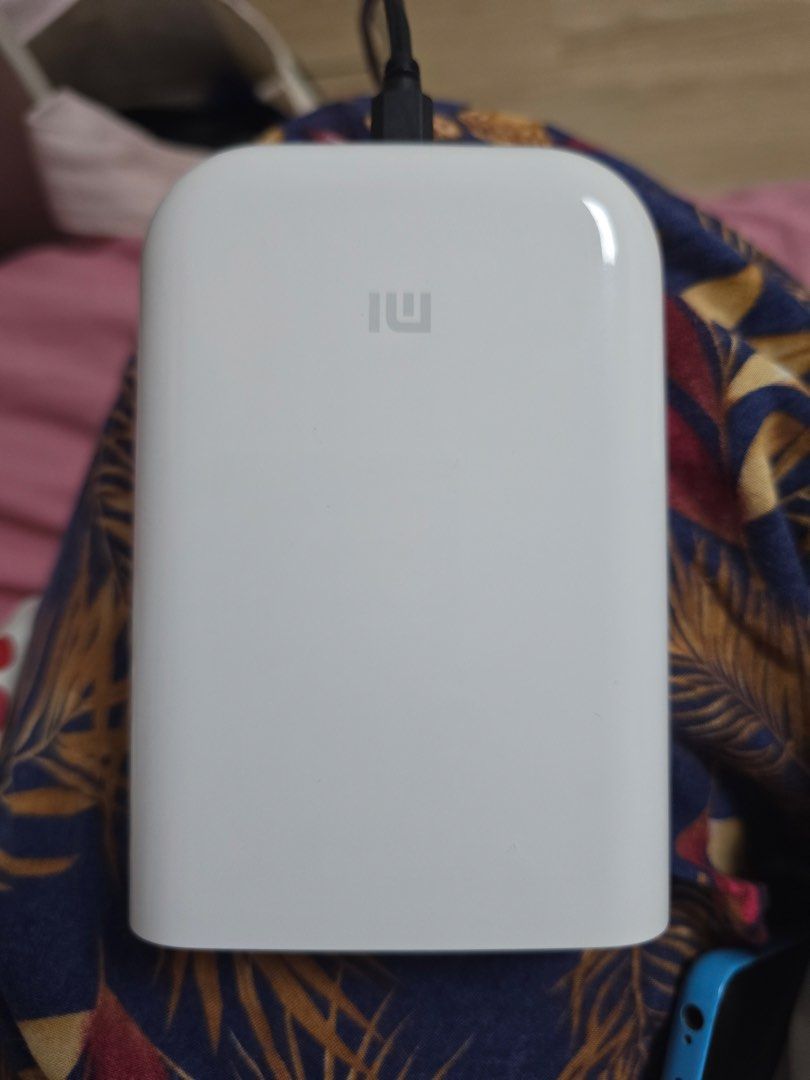 Original Xiaomi Portable Photo Printer (Category: Printers, Scanners & Copiers) located in Manila. Submitted by milleshoppppp (Listing ID 1467331009, Image 2). Description: Mi Portable Photo Printer Condition: 9/10 - no micro-usb and photopaper included but has box - all working well (check vids and photos for reference) Price: ₱1,650 (Still negotiable).