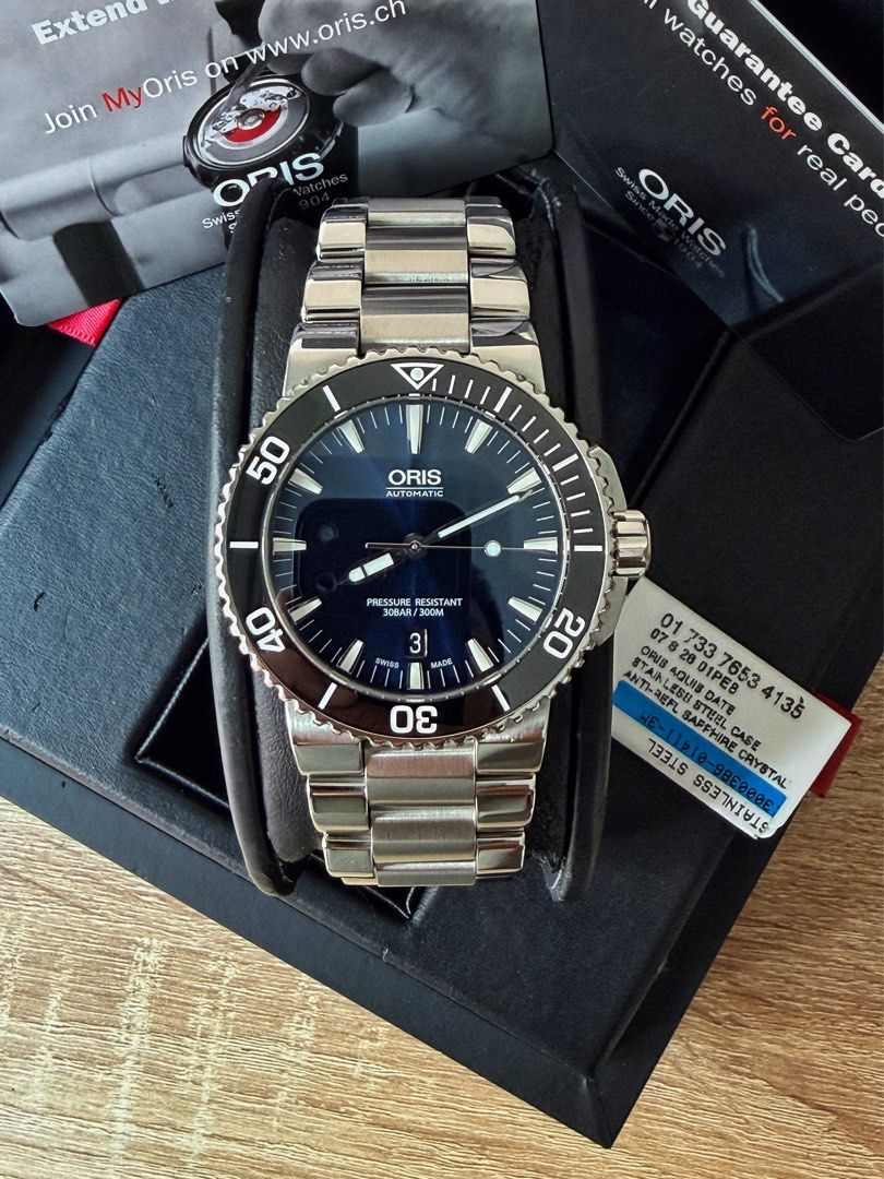 Oris Aquis Date Black Ceramic Bezel Blue Dial (Category: Men's Watches) located in Pasig City. Submitted by migspaggabao (Listing ID 1467224714, Image 3). Description: Oris Aquis Date Black Ceramic Bezel Blue Sunray Brushed Dial Ref. No. 01 733 7653 4135-07 8 26 01PEB Oris Calibre 733-1 41 Hours Power Reserve 43 mm case 9.7/10 condition. Mint! Dated yr 2017. Below SRP USD 1,950 (PHP 123k) Inclusions: watch, double box, manual, hang tag, guarantee