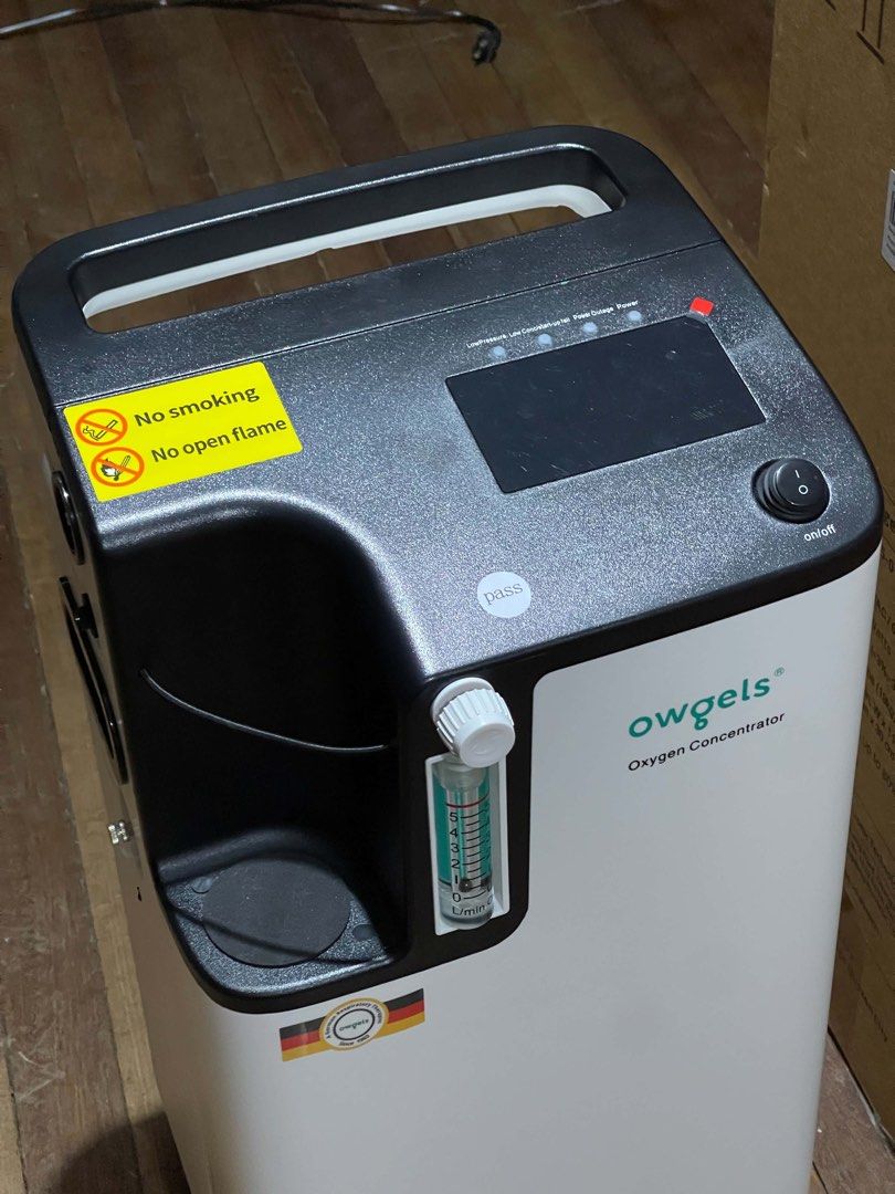 Owgels 5L Portable Oxygen Concentrator (Category: Medical Supplies & Tools) located in Quezon City. Submitted by ohnomary (Listing ID 1467250076, Image 2). Description: - Brand/Model: Owgels 5L Oxygen Concentrator (OZ-5-01TW0) - Condition: Clean unit, ready for home respiratory care setup - Key Features: Digital display, flow meter up to 5L/min, and rear oxygen/atomization ports - Manufacture Date: April 1, 2026 - Inclusion: Original cardboard bo