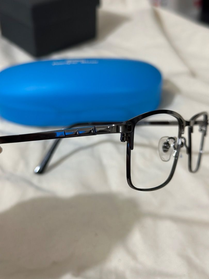 Pacific Blue Eyeglass Frames with Case and Spare Lenses (Category: Sunglasses & Eyewear) located in Mandaluyong City. Submitted by lovedbyjaaaam (Listing ID 1467277479, Image 3). Description: - Brand/Model: Pacific Blue PTZ0663-AR - Color: Dark gunmetal grey - Shape & Material: Rectangular metal frame with comfortable acetate temples - Fit: Standard nose pads attached - Inclusions: Matching bright blue hardshell case + extra clear demo/prescripti