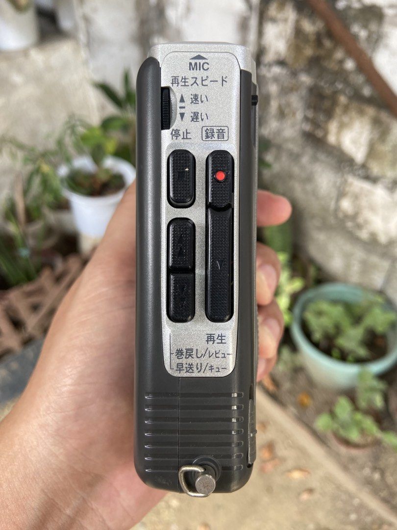 Panasonic RQ-L25 Mini Cassette Recorder (Category: Portable Music Players) located in Malolos. Submitted by anthony_collectibles (Listing ID 1467304799, Image 3). Description: Good working condition - Model: Panasonic RQ-L25 Mini Cassette Recorder - Color: Classic grey with Japanese text label on the back - Controls: Playback speed control dial, record button, and standard side-mounted playback controls - Audio: Built-in front panel speaker - Pow