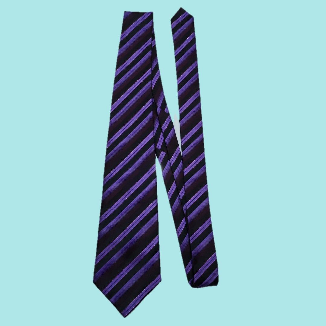 Paul Smith Purple Striped Silk Necktie (Category: Ties) located in Tarlac. Submitted by senkustuff (Listing ID 1467305337, Image 2). Description: - Brand: Paul Smith - Material: High-quality silk with subtle metallic threading - Design: Striking purple and black stripes - Details: Standard width blade, clean lining, and signature branding label on the back - Condition: Great pre-owned condition - Style: Ideal for business meetings, formal events,