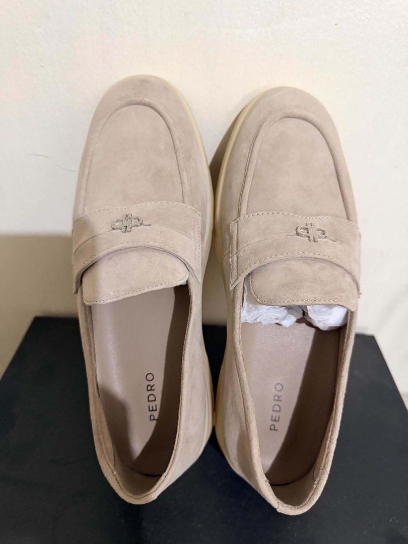 Pedro Beige Suede Loafers (Category: Loafers) located in Quezon City. Submitted by bela_goodfinds (Listing ID 1467268394, Image 2). Description: - Brand: Pedro - Style: Suede loafers with slip-on penny strap design - Color: Beige - Details: Silver-tone hardware branding - Condition: Excellent, minimal wear on flat rubber soles, clean insoles - Bonus: Original packing paper still inside the toe box to maintain shape.