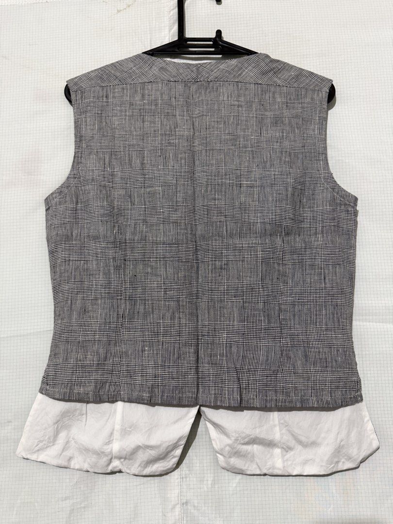 pegorer plaid waistcoast vest (Category: Sleeveless) located in Quezon City. Submitted by sxmotrie (Listing ID 1467271966, Image 2). Description: - Pegorer Sleeveless Vest (size 40) - made in Italy - 3 white front buttons, chic cut-out detail near the neckline, and contrasting white lining peeking out at the back hem.