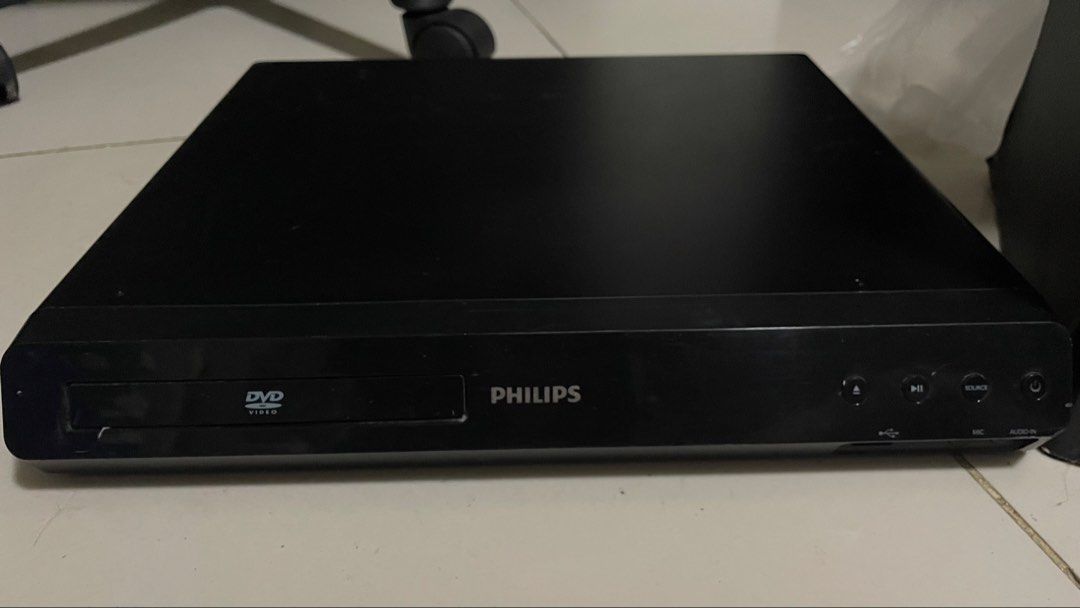 Philips Home Theater System with DVD Player and Speakers (Category: Soundbars, Speakers & Amplifiers) located in General Trias. Submitted by ashi_kt0 (Listing ID 1467211313, Image 2). Description: - Complete Philips home theater system: main DVD player, large subwoofer, and 5 satellite speakers - Sleek black finish across all matching components - Includes plenty of attached wiring for easy setup - Tested and working: powers on and plays discs sm