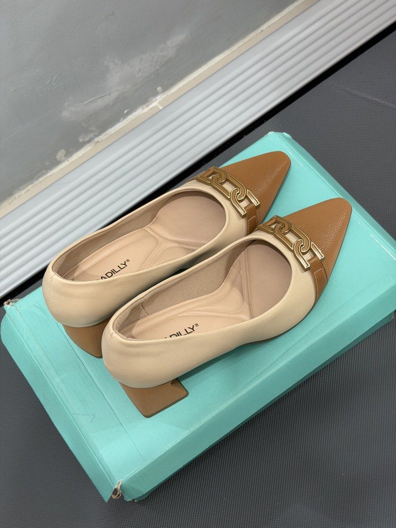 Piccadilly Two-Tone Block Heel Pumps (Category: Heels) located in Makati City. Submitted by rrlimbo (Listing ID 1467255776, Image 3). Description: - Brand: Piccadilly - Size: 7 - Color: Beige and brown - Comfort: Soft cushioned insoles for all-day wear - Inclusion: Original box - Condition: Excellent, wear 2x only RFS: Wrong size Original Price: 3,011.00 📍Makati.