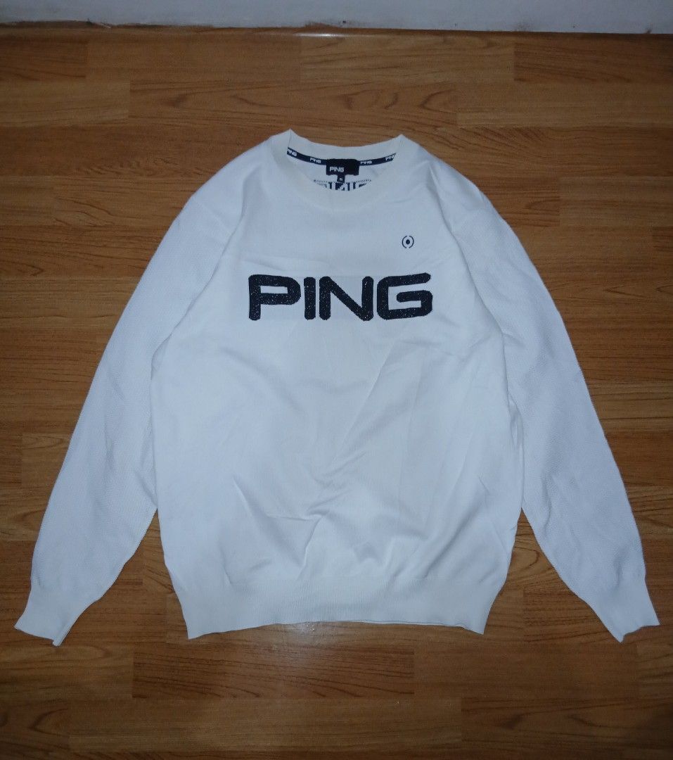 PING White Long Sleeve Golf Sweater Size M (Category: Coats, Jackets and Outerwear) located in General Santos City (Dadiangas). Submitted by afsph1996 (Listing ID 1467273088, Image 1). Description: - Brand: PING Golf Knittes L/S - Color: White - Size: Medium (tag attached) -Dimes 21W 27L - Design: Large sparkling PING logo on the front and small logo lettering on the back collar - Material: Comfortable polyester and nylon blend - Details: Knit te