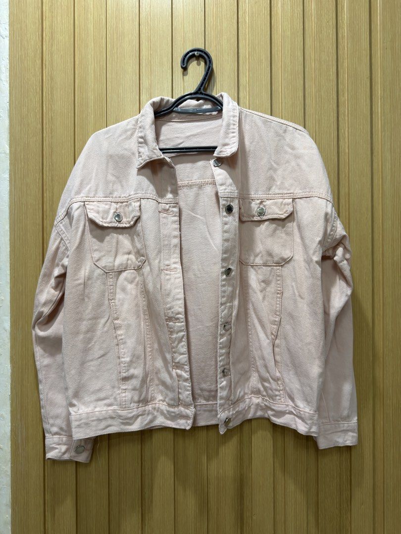 Pink Denim Jacket (Category: Coats, Jackets and Outerwear) located in Bacoor. Submitted by preloved_with_love_ (Listing ID 1467335170, Image 1). Description: Light pink denim jacket with silver buttons and front pockets. Tag attached shows measurements: width 20 inches, length 23 inches. Classic button-up style with collar. Easy to layer over tees or dresses. Casual everyday piece..