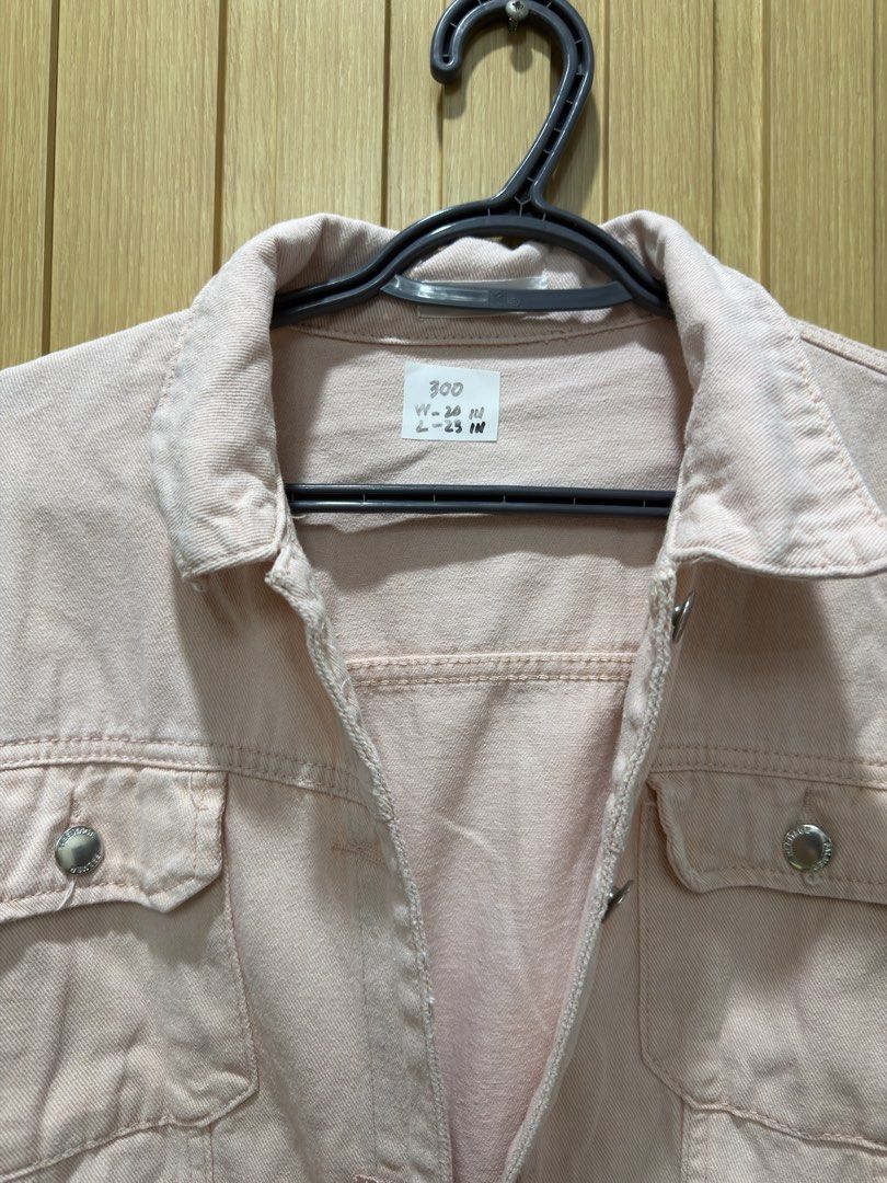 Pink Denim Jacket (Category: Coats, Jackets and Outerwear) located in Bacoor. Submitted by preloved_with_love_ (Listing ID 1467335170, Image 3). Description: Light pink denim jacket with silver buttons and front pockets. Tag attached shows measurements: width 20 inches, length 23 inches. Classic button-up style with collar. Easy to layer over tees or dresses. Casual everyday piece..