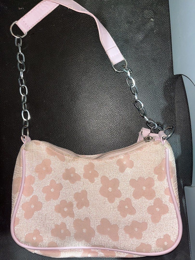 Pink Floral Shoulder Bag with Chain Strap (Category: Shoulder Bags) located in Manila. Submitted by rhiangastadora (Listing ID 1467292963, Image 1). Description: - Design: Retro floral pattern with pink faux leather trim - Strap: Pink shoulder strap accented with stylish silver-tone chain links on both sides - Closure: Secure top zipper opening to a clean dark inner lining - Fit: Compact and comfortable size that sits nicely under the arm.