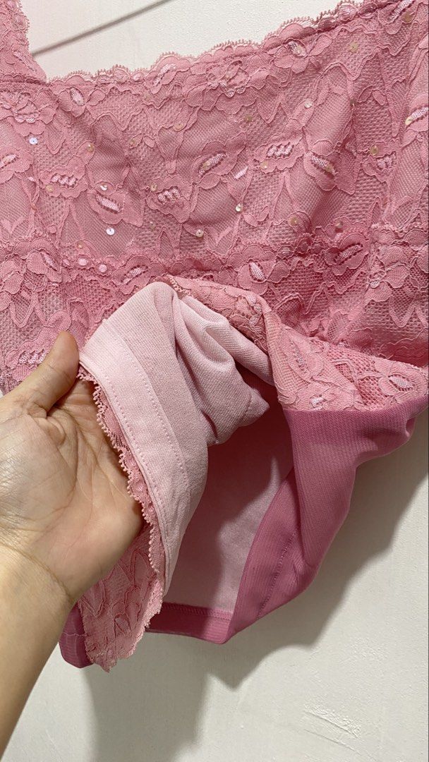 Pink Lace Sequin Tank Top Camisole (Category: Sleeveless) located in Ozamiz City. Submitted by carisclosetcleanup (Listing ID 1467243169, Image 3). Description: - Style: Pink lace camisole top with a trendy square neckline and wide straps - Details: Subtle sequins on the upper front panel with a layered floral lace pattern - Comfort: Fully lined interior for a smooth and comfortable fit - Versatility: Perfect for casual everyday wear or easily dr