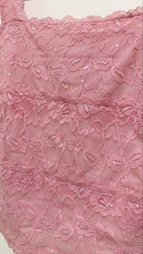 Pink Lace Sequin Tank Top Camisole (Category: Sleeveless) located in Ozamiz City. Submitted by carisclosetcleanup (Listing ID 1467243169, Image 2). Description: - Style: Pink lace camisole top with a trendy square neckline and wide straps - Details: Subtle sequins on the upper front panel with a layered floral lace pattern - Comfort: Fully lined interior for a smooth and comfortable fit - Versatility: Perfect for casual everyday wear or easily dr