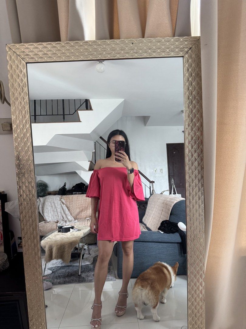 Pink Off-Shoulder Ruffle Mini Dress (Category: Dresses) located in Quezon City. Submitted by edescootauco (Listing ID 1467265519, Image 3). Description: - Color: Vibrant bright pink - Design: Off-shoulder with flared ruffle sleeves and back hem split - Fit: Loose fit through the body, suits small to medium frames - Length: Short - Condition: Worn once for a quick try-on - Perfect for: Parties or casual days out.