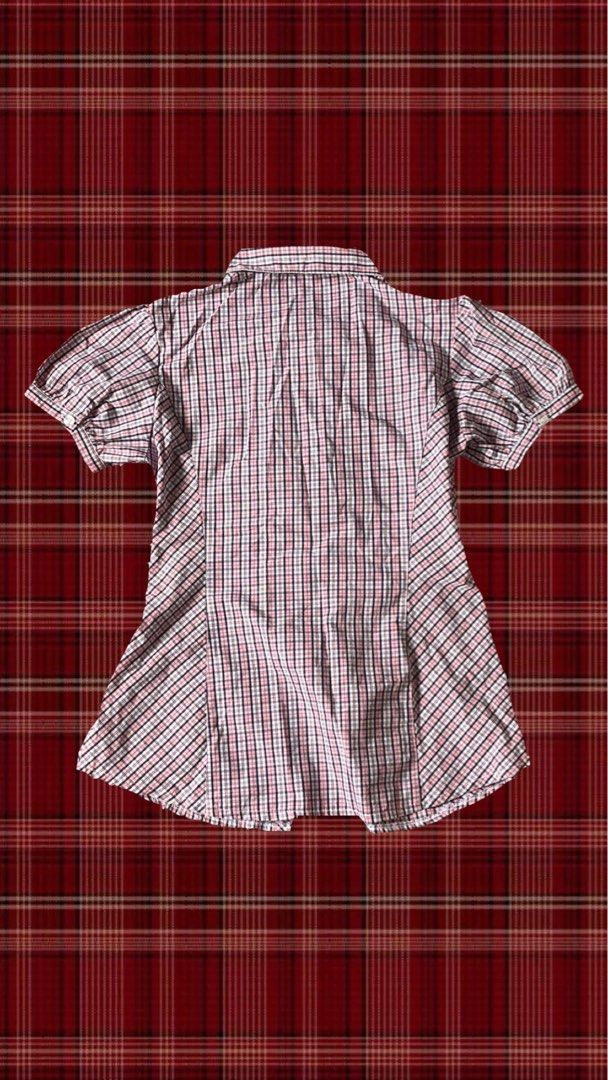 Pink Plaid Ruffle Button-Up Short Sleeve Blouse (Category: Blouses) located in Quezon City. Submitted by gloriouslilith (Listing ID 1467175654, Image 2). Description: - Color: Pink, black, and white plaid pattern -fits to S-M - Sleeves: Short puff sleeves with button cuffs - Closure: Front button-up with stylish white-trimmed ruffles - Fit: Tailored front and back paneling for a fitted silhouette - Neckline: Classic collared neckline -good for so