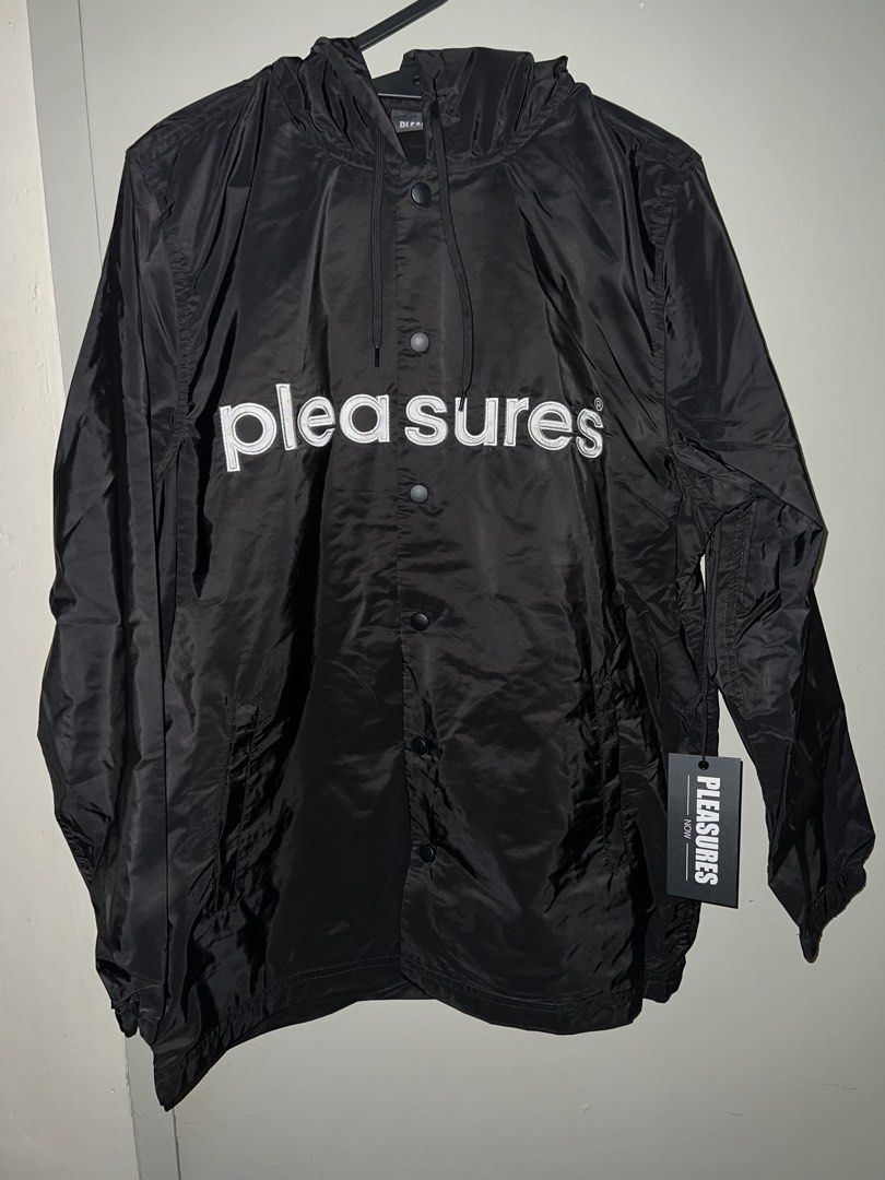 Pleasures Keys Coaches Jacket (Category: Coats, Jackets and Outerwear) located in Bacolod City. Submitted by ghostgiiirl___ (Listing ID 1467308095, Image 2). Description: - Brand: Pleasures - Item: Coaches Jacket with Hood - Color: Black - Size: Medium - Condition: Brand new with original tags - Design: Large white embroidered logo on chest - Features: Matching black hood with drawstrings, front snap button closure, and side pockets - Material: 1