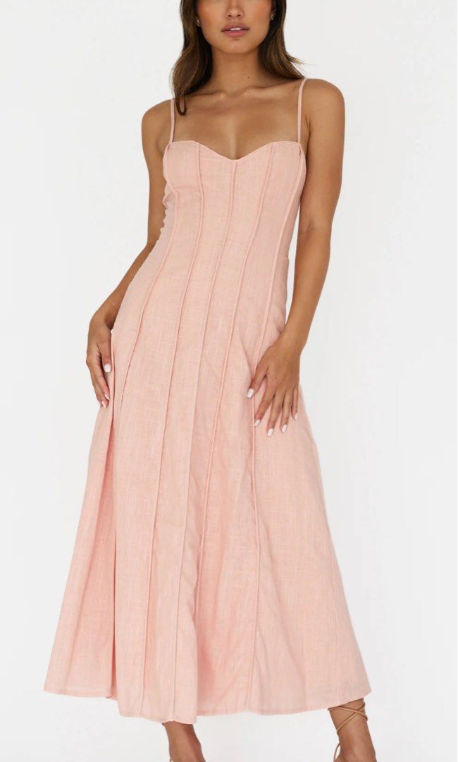 Pleat Midi Dress XS (Category: Dresses) located in Manila. Submitted by m.prelov (Listing ID 1467328652, Image 1). Description: - Style: Long pink maxi dress with spaghetti straps - Design: Sweetheart neckline and structured corset bodice detailing - Length: Ankle-length - Condition: Worn once, zero flaws, super clean and ready to wear - Perfect for: Parties, weddings, and formal events.