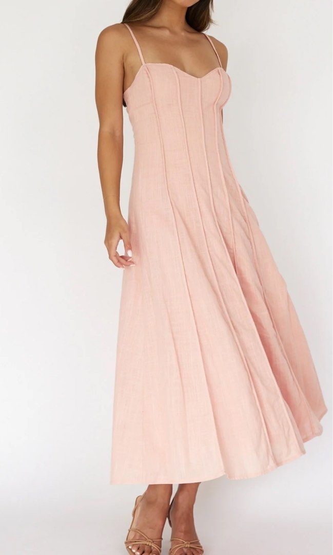 Pleat Midi Dress XS (Category: Dresses) located in Manila. Submitted by m.prelov (Listing ID 1467328652, Image 2). Description: - Style: Long pink maxi dress with spaghetti straps - Design: Sweetheart neckline and structured corset bodice detailing - Length: Ankle-length - Condition: Worn once, zero flaws, super clean and ready to wear - Perfect for: Parties, weddings, and formal events.