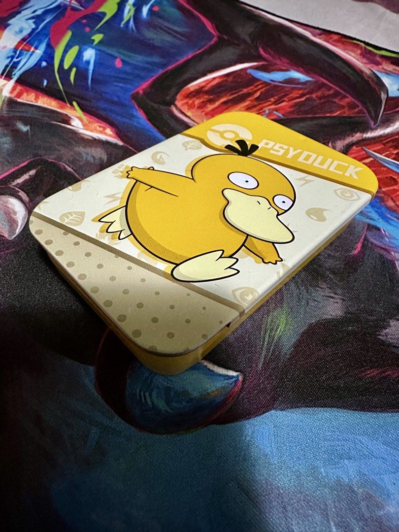 Pokemon Center Psyduck Dice Case/Tin (Category: Card Boxes & Cases) located in Quezon City. Submitted by dongilmore (Listing ID 1467309108, Image 1). Description: Pokemon Center Psyduck Dice Case/Tin *Dents can be seen in pictures WITH FREE DICE AND COUNTERS.